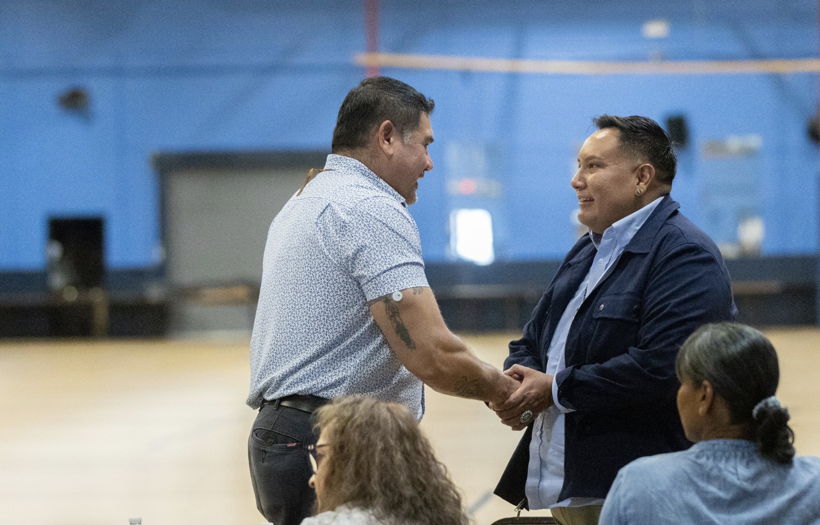 Mel Willie of NeighborWorks greets a tribal leader.