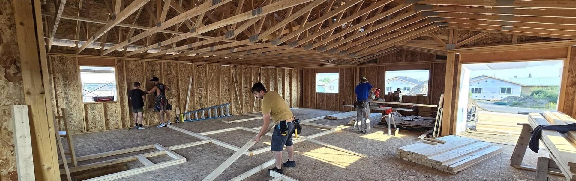 A crew works on building a home.